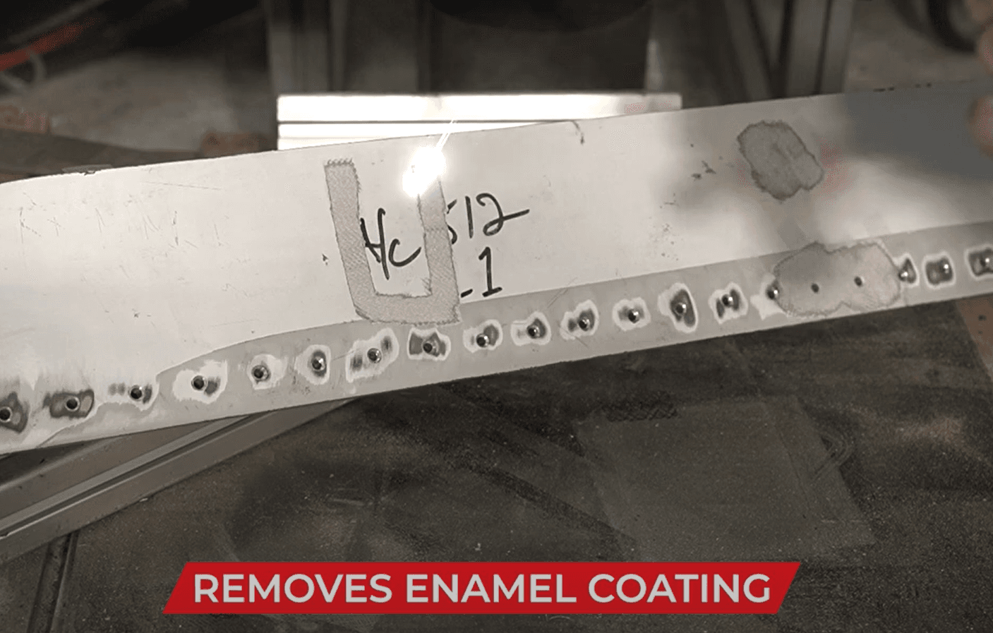 FP-300 laser removing enamel coating from aluminum aircraft component
