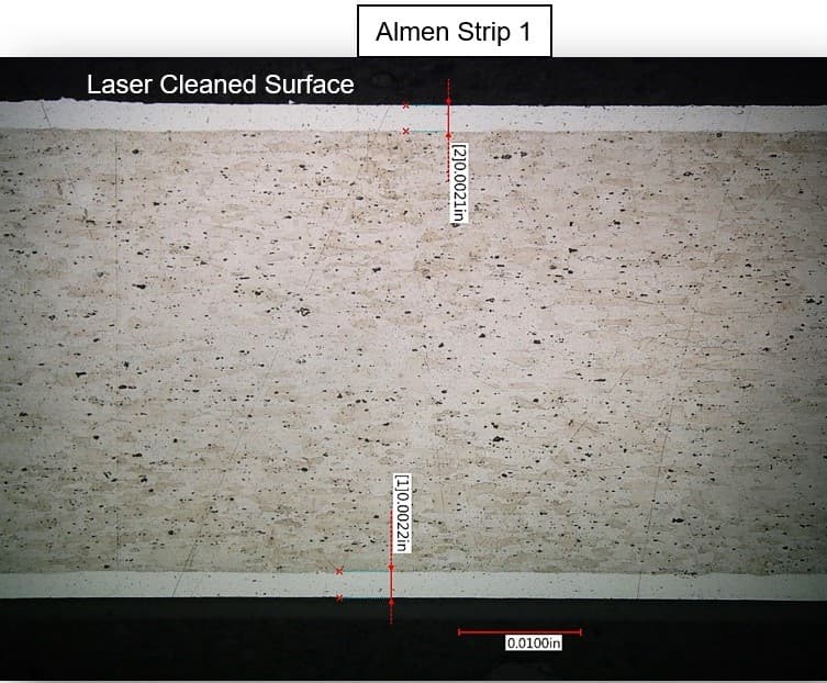 Cross-sectional microscopy of Almen strip after FP-300 laser ablation — alclad layer fully intact